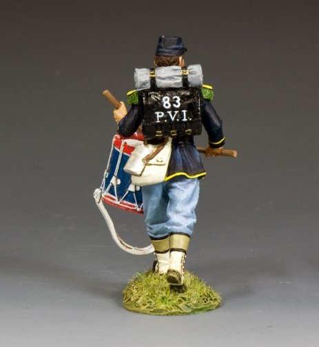 Model of a toy soldier with a drum and backpack labeled '83 P.V.I.' on a gray background
