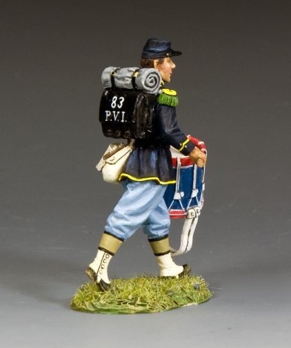 Military miniature Figurine of a soldier with a drum and backpack on a gray background