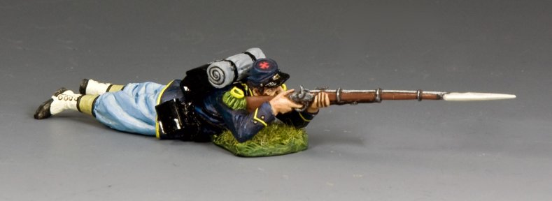Lying Prone Firing Toy soldier in Civil War uniform with rifle on a gray background