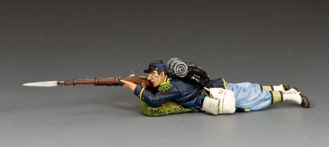 Lying Prone Firing. Toy soldier figure of a Civil War era soldier lying on the ground with a rifle.