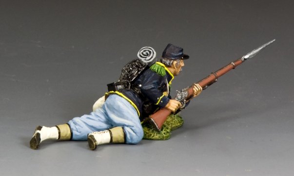 Toy soldier military miniature in Civil War uniform with rifle on a gray background