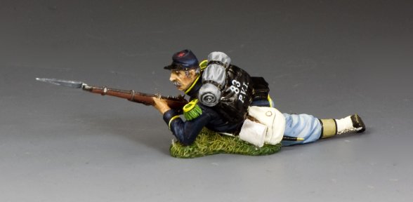 Toy soldier figure of a soldier in a crouching position with a rifle on a gray background