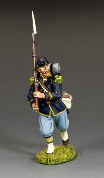 Model of a toy soldier Infantryman Advancing (Hand on Rifle) in Civil War uniform holding a rifle and a hammer on a gray background