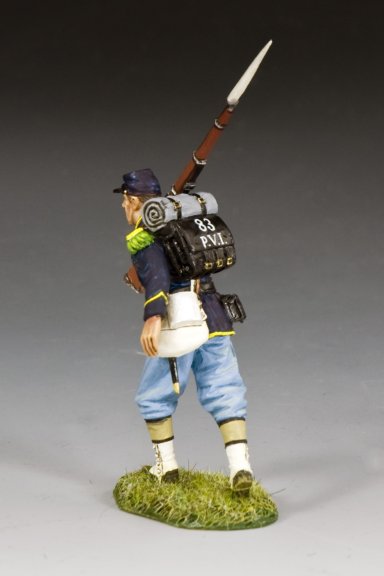 Military miniature Union infantryman marches with rifle slung on shoulder, wearing full gear.