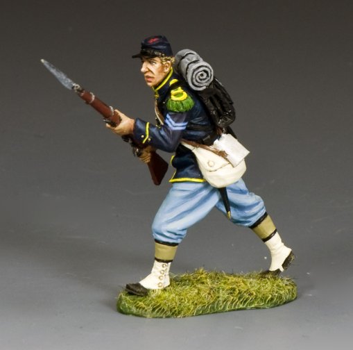 Model figure of a toy soldier in Civil War uniform with a rifle and backpack on a gray background
