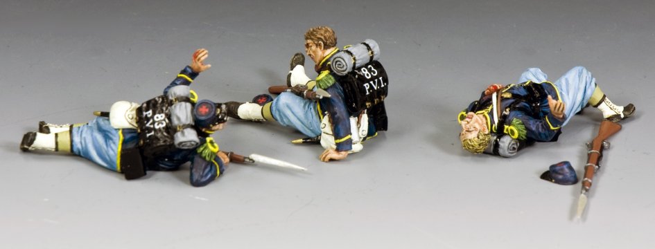 Three military miniature action figures in a dynamic pose on a gray background.