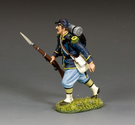 Toy soldier figure Infantryman Advancing in historical uniform with a spear on a gray background