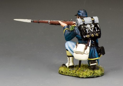Military miniature Model figure Kneeling Infantry man with a rifle on a gray background.
