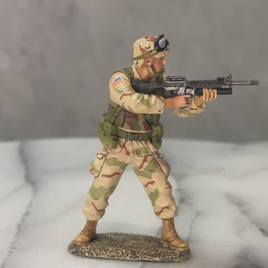 360 view of Toy Soldier U.S. Army Ranger aiming M16A2 with M203 grenade launcher in desert camo, mid-action.