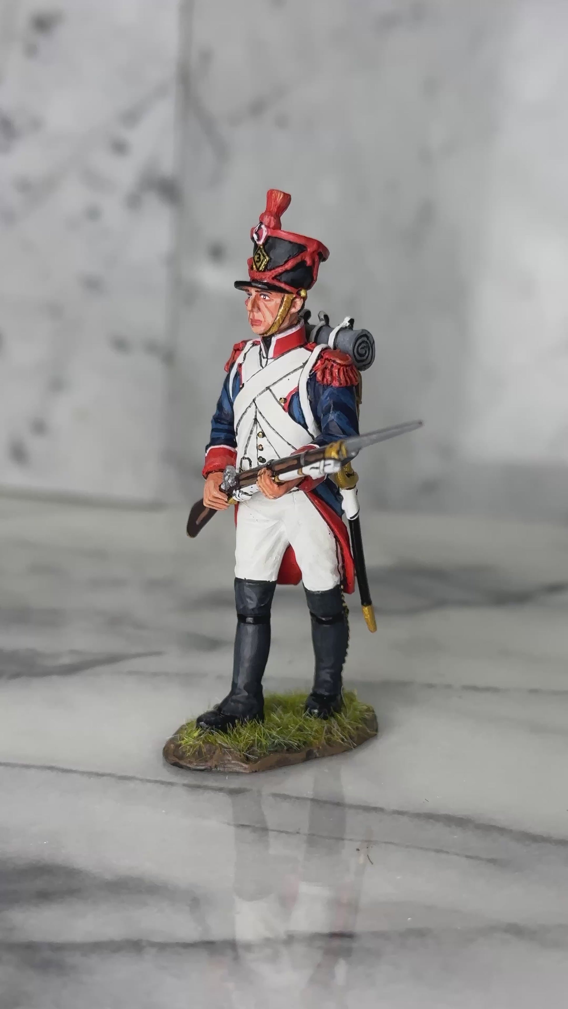360 view of King & Country FLI Advancing Port Arms, French Light Infantry advancing with Charleville musket and fixed bayonet held across body at port arms, red plume shako, blue coat with red facings, 1/30 60mm matte figure, NA531