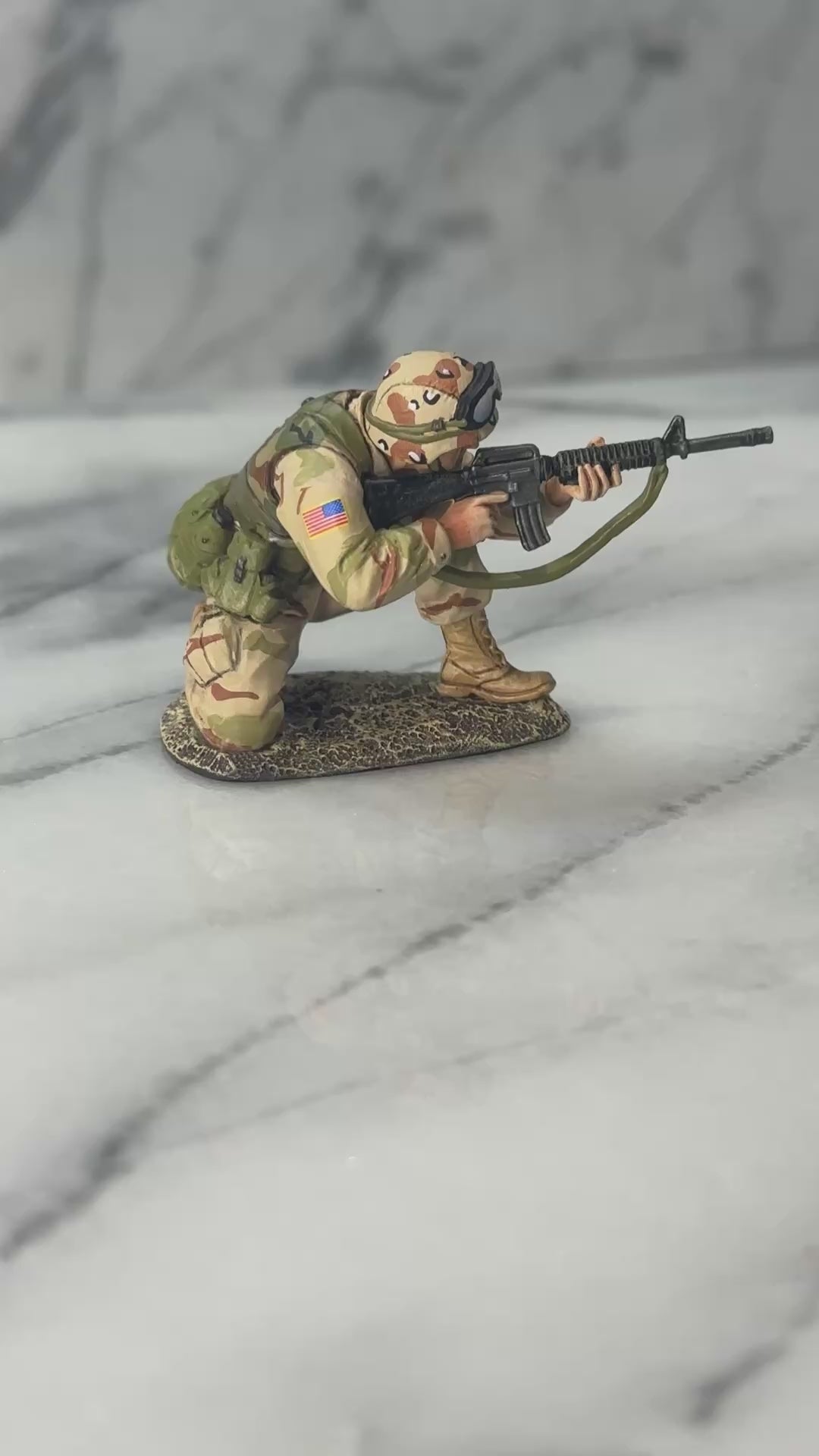 360 view of Collectible toy soldier miniature army men Ranger Kneeling.