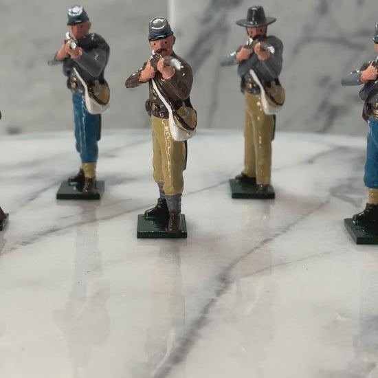 360 view of Collectible toy soldier army men Confederate Infantry Firing and Loading..