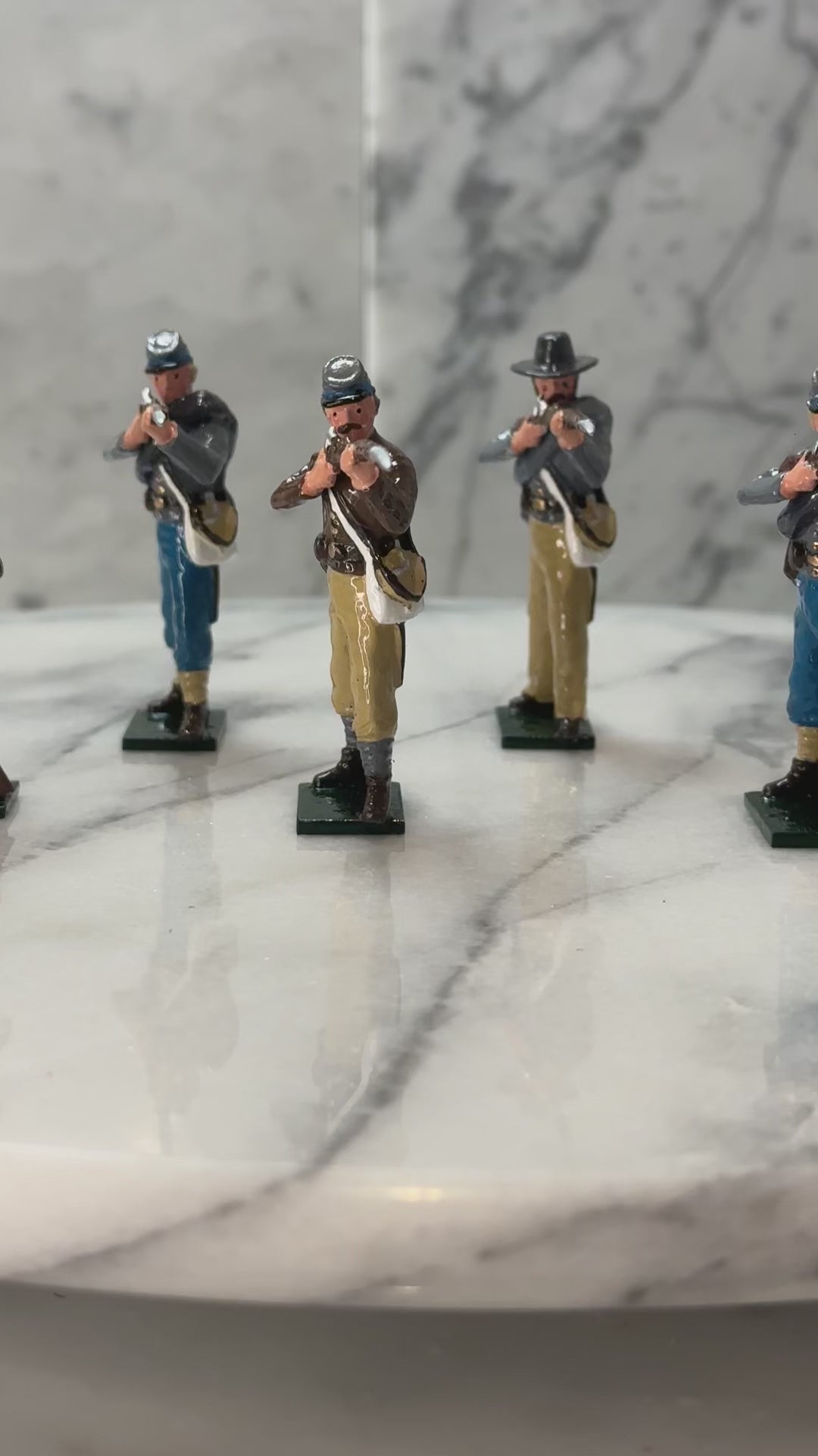 360 view of Collectible toy soldier army men Confederate Infantry Firing and Loading..