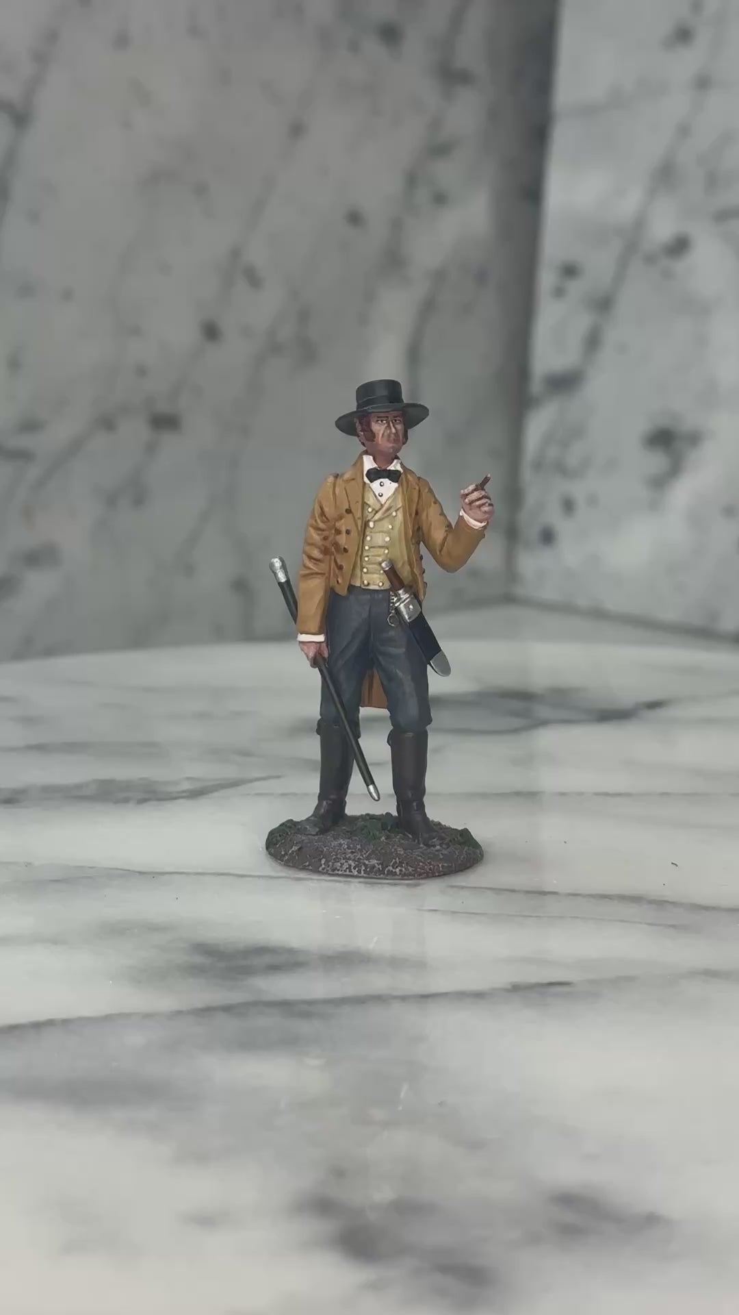 360 view of Collectible toy soldier miniature army men James Bowie at the Alamo.