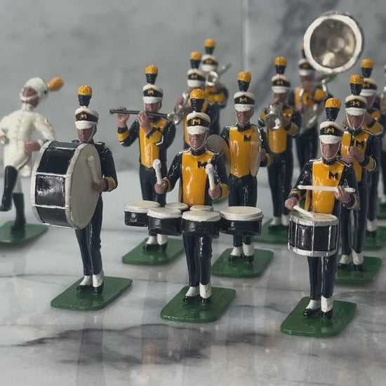 360 view of toy miniature marching band university of Michigan playing fight song.