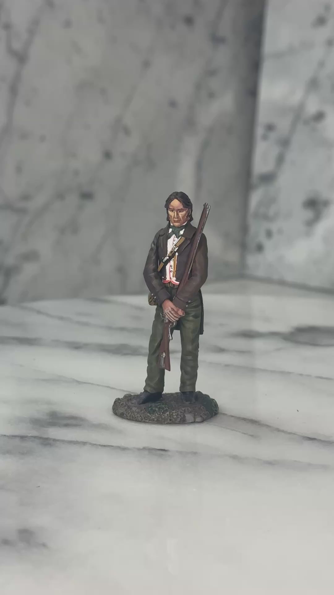 360 view of Collectible toy soldier miniature army men David Crockett at the Alamo in brown jacket.