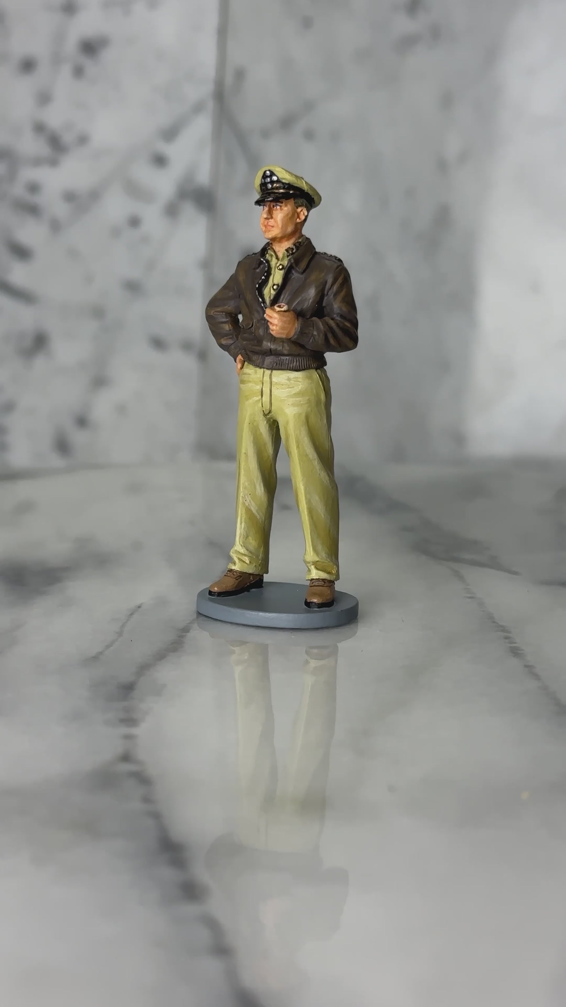 360 degree view of General Douglas MacArthur WWII toy soldier in A2 jacket and peaked cap holding corncob pipe King & Country 1/30 scale matte figure