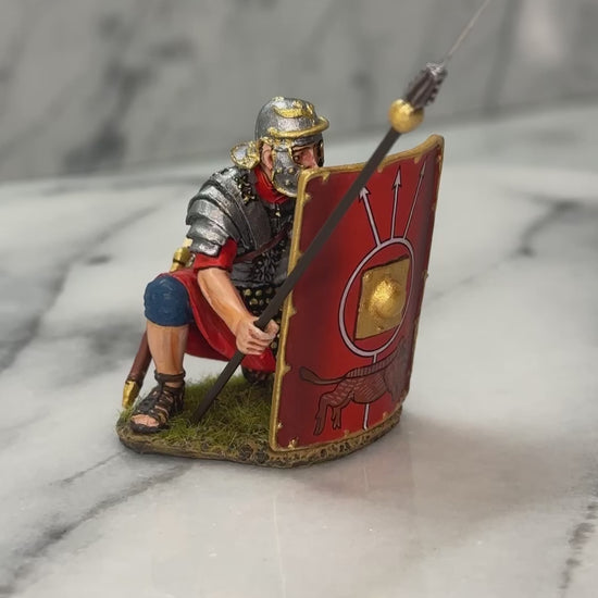 360 view of Collectible toy soldier miniature army men Kneeling Roman Legion.