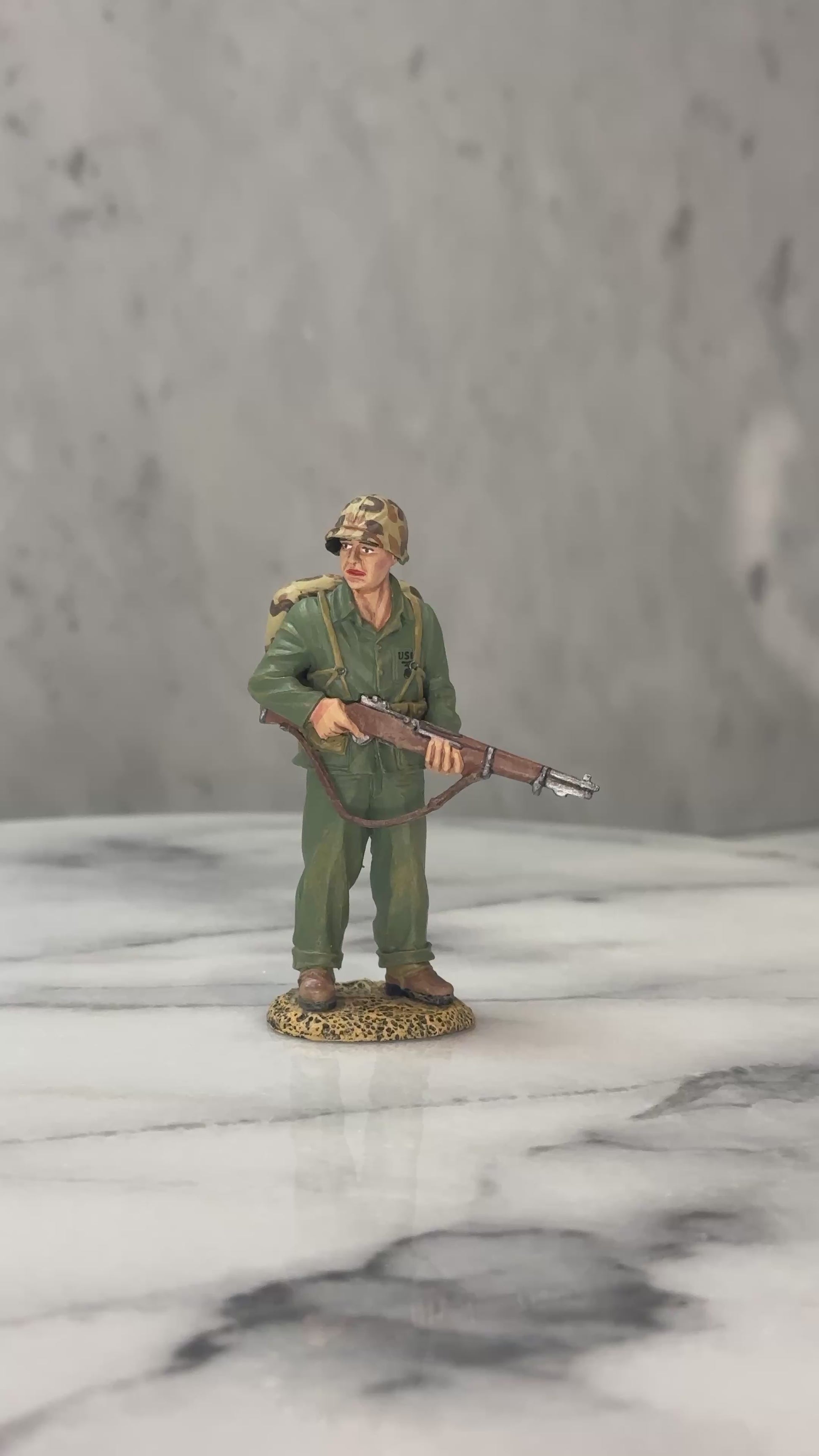 360 view of Watching Marine toy soldier.