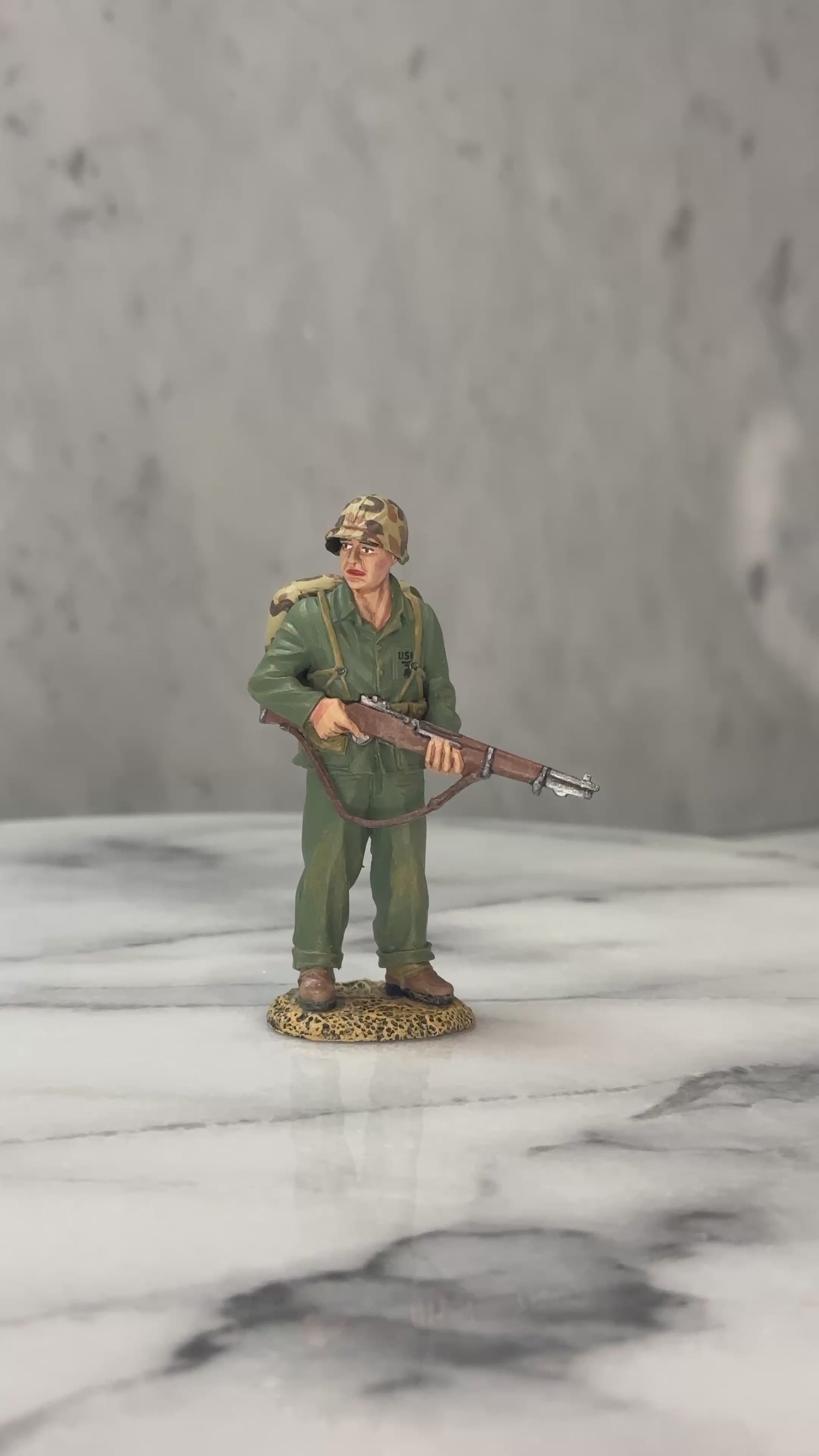 360 view of Watching Marine toy soldier.
