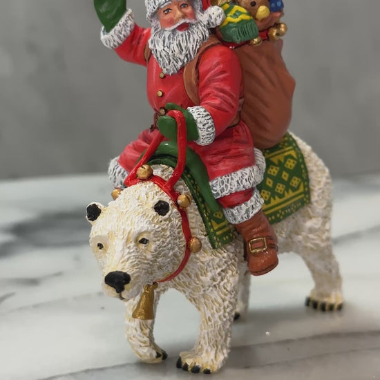 360 view of Santa on a polar bear with gifts.