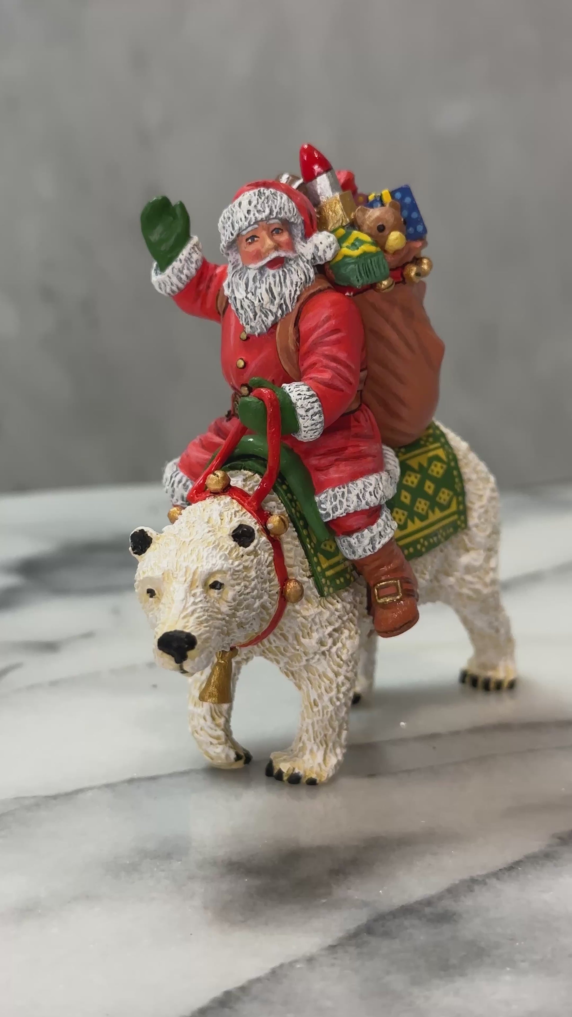 360 view of Santa on a polar bear with gifts.