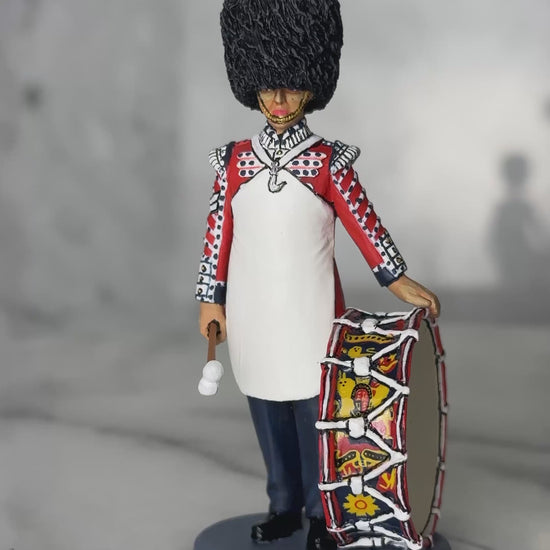 360 view of toy soldier King & Country Scots Guards Bass Drummer — 1/30 scale matte-painted figure in ceremonial dress with white apron and regimental bass drum. Catalog CE123.