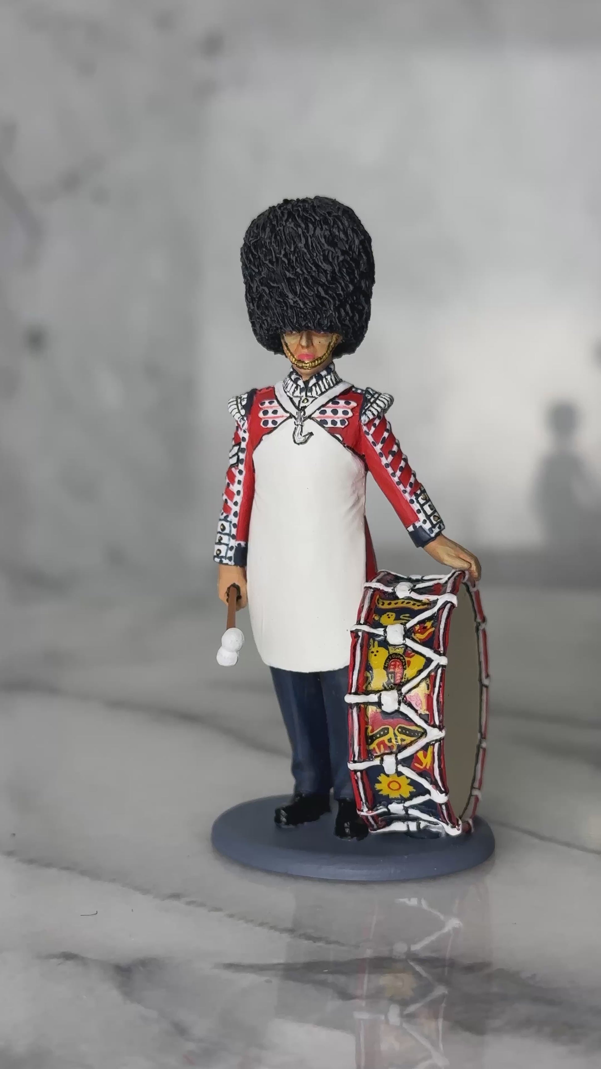 360 view of toy soldier King & Country Scots Guards Bass Drummer — 1/30 scale matte-painted figure in ceremonial dress with white apron and regimental bass drum. Catalog CE123.
