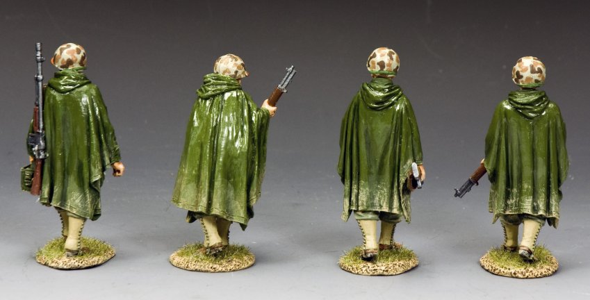 Four WWII U.S. Marines toy soldiers in rain ponchos on patrol with M1s and BAR in hand. 1/30 scale matte-finished figures.