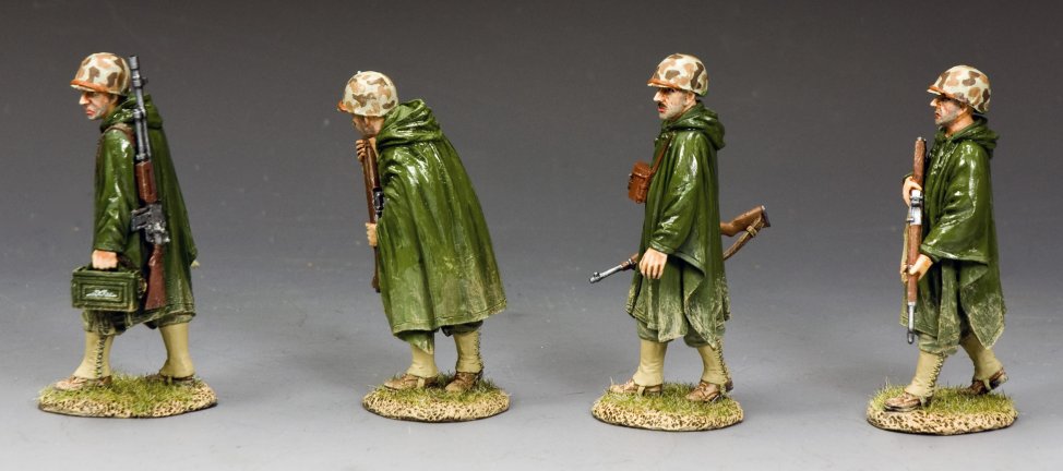 Four WWII U.S. Marines military miniatures in rain ponchos on patrol with M1s and BAR in hand. 