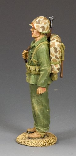 Toy soldier figure in military uniform with backpack and rifle on a gray background
