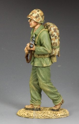 Walking Marine. Model of a soldier in camouflage uniform with backpack and rifle on a gray background
