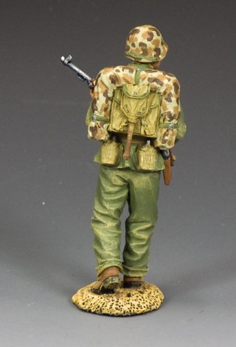 Walking Marine Officer. Model of a soldier in camouflage uniform with backpack and rifle on a gray background
