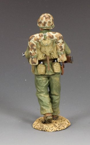 Walking Marine Sergeant. Model of a soldier in camouflage uniform with backpack and equipment on a gray background
