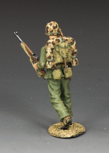 Shouting Marine Officer. Model of a soldier in camouflage uniform with a rifle on a gray background