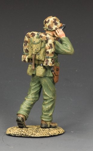 Shouting Marine Officer. Military miniature figure in military uniform with backpack and helmet on a gray background