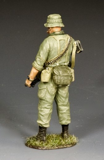 Toy Soldier in green military uniform with backpack on a gray background
