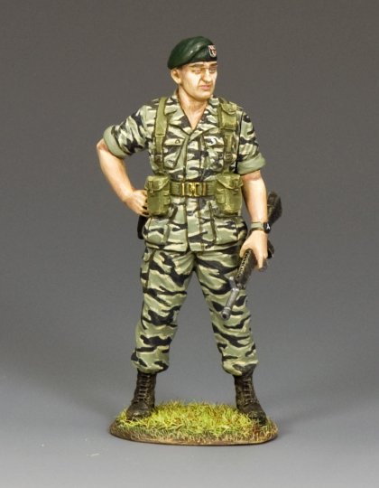 Green Beret Colonel in Tiger Stripes standing on grass.