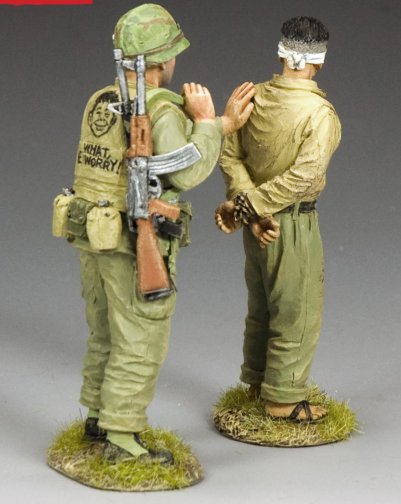 Vietnam U.S. Marine escorts blindfolded NVA prisoner with AK-47; flak vest reads “What Me Worry?” from MAD Magazine. 1/30 scale. Military miniatures.