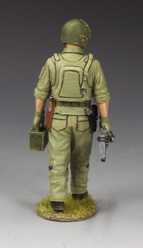 Model soldier Vietnam Huey door gunner carrying M60 and ammo can, dressed in flak vest and helmet. 1/30 scale, matte finish.