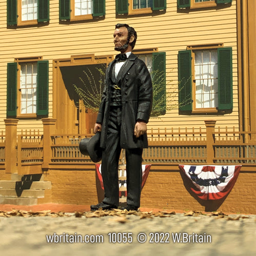 Collectible toy soldier miniature Abraham Lincoln. He is standing with hat in hand.