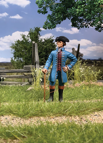 Collectible toy soldier miniature Thomas Jefferson . He is wearing a blue jacket while standing in a field.