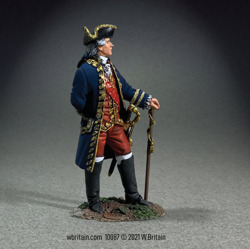 Collectible toy soldier miniature General Rochambeau wearing a long blue jacket and sword.