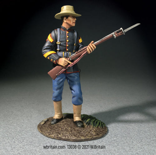 Collectible toy soldier miniature U.S. Marine NCO 1898. He is carrying a rifle.