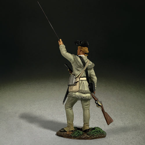 View from behind of collectible toy soldier loading musket.