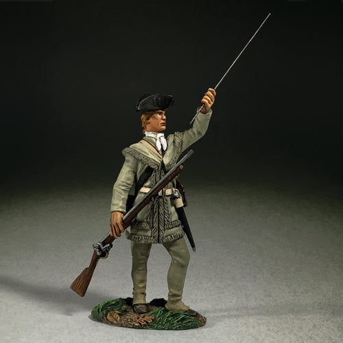 Collectible toy soldier miniature standing while loading a musket.