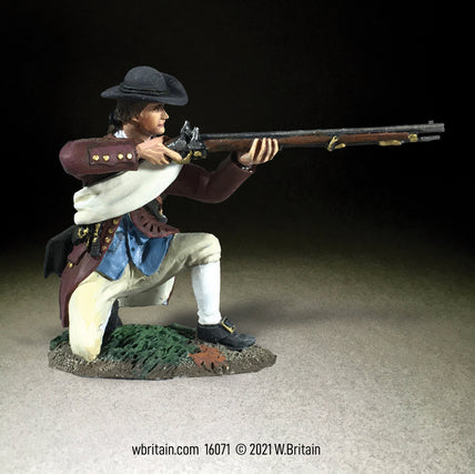 Collectible toy soldier miniature kneeling while aiming a musket.