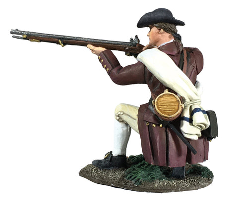 Collectible toy soldier miniature kneeling while aiming a musket.