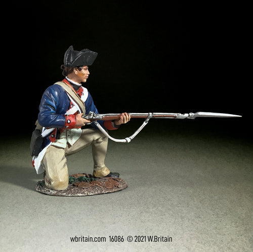 Collectible toy soldier miniature kneeling while holding a musket with bayonet.