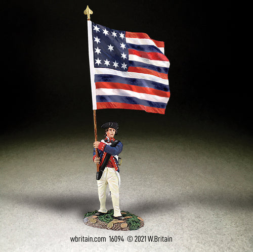 Collectible toy soldier miniature Ensign holding U.S. Flag.